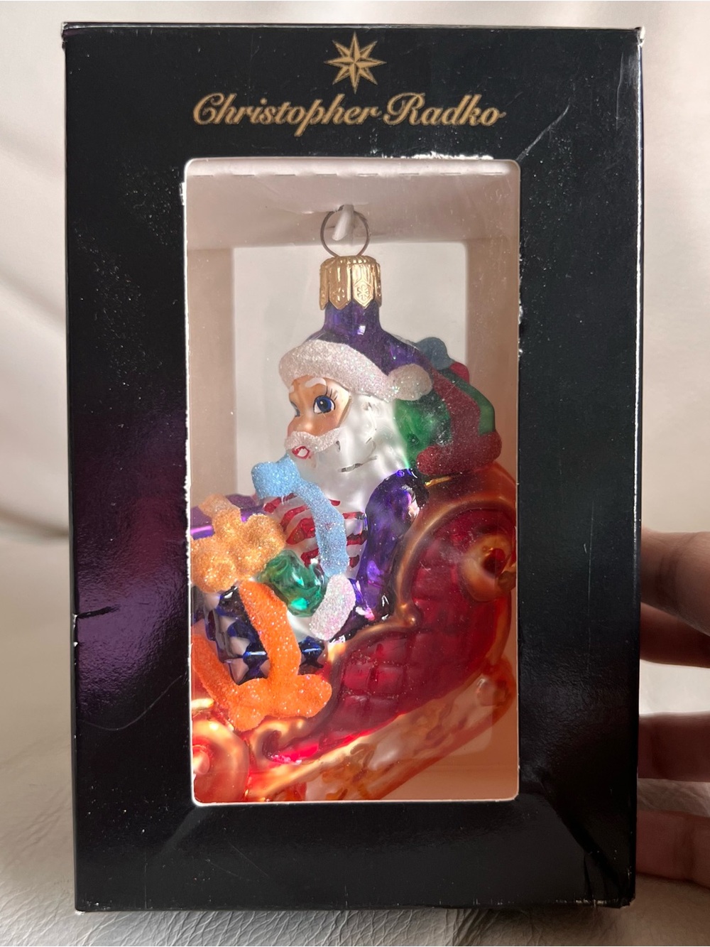Christopher Radko Purple-Hatted Santa in Red Sleigh Hanging Ornament